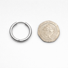 16 mm hoop earring shown next to 20 pence coin for size reference