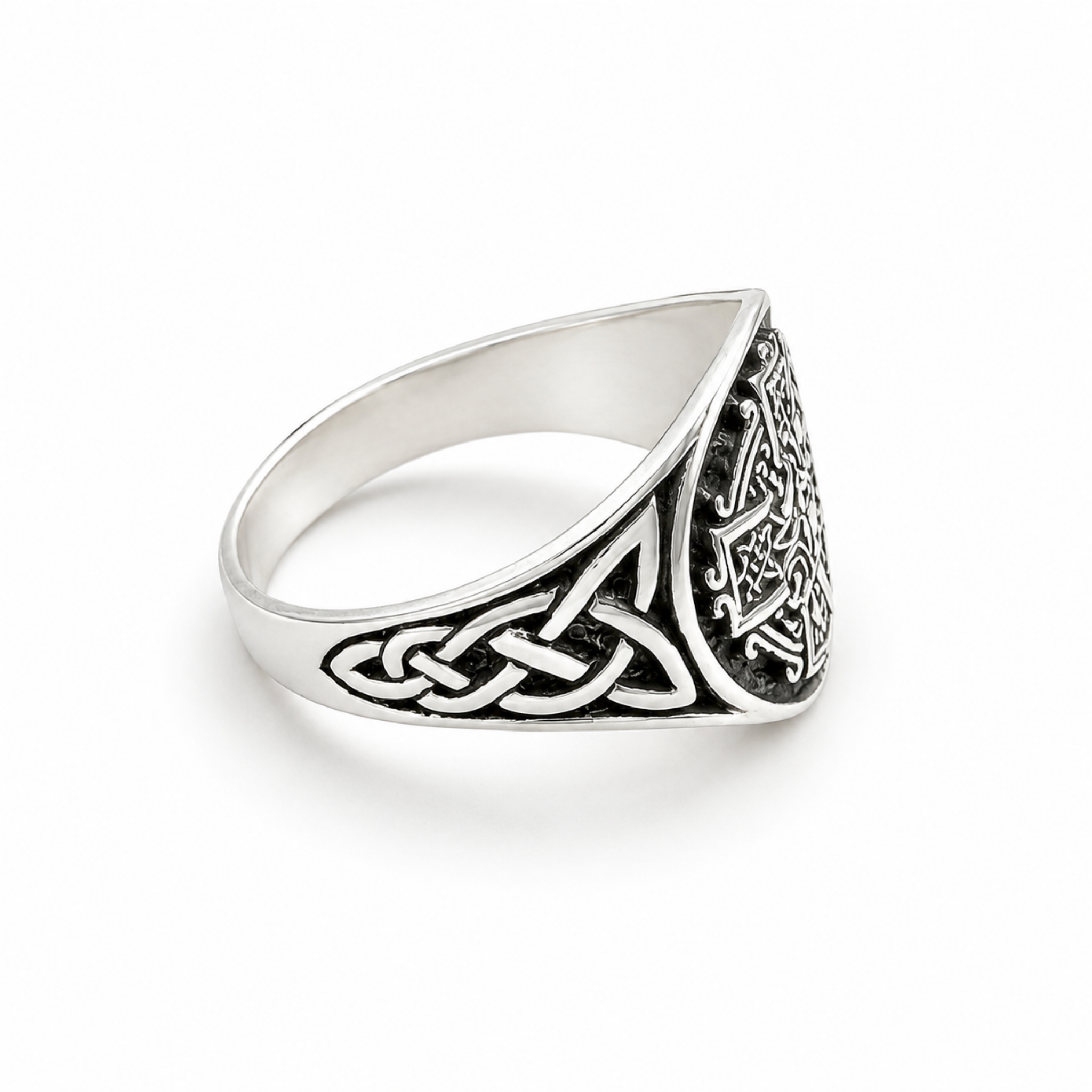 Side view of a 925 sterling silver oxidised Celtic Cross ring showing the detailed Celtic knotwork shoulders.