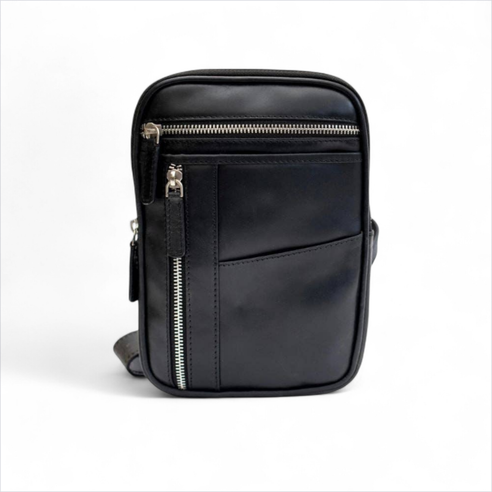 Black leather crossbody bag with zippers on a white background