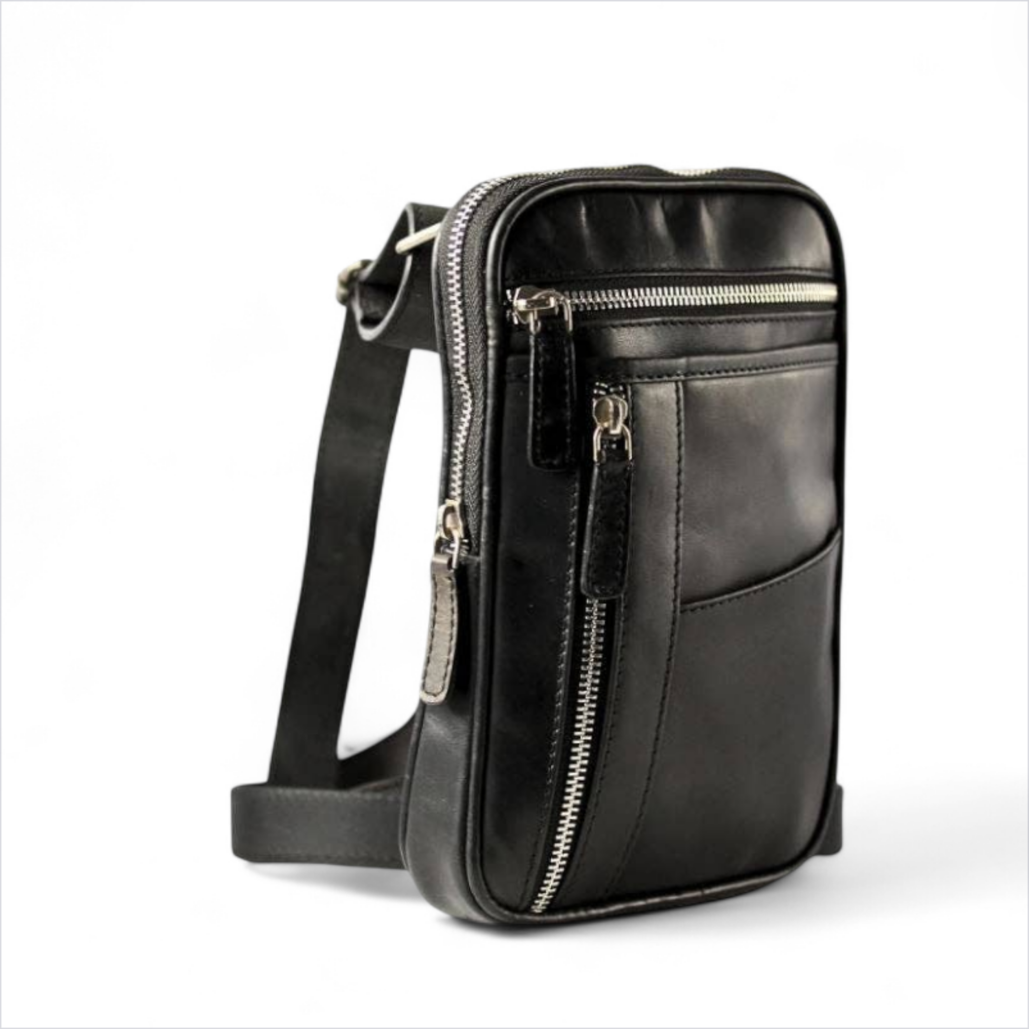 Black leather crossbody bag with zippers on a white background