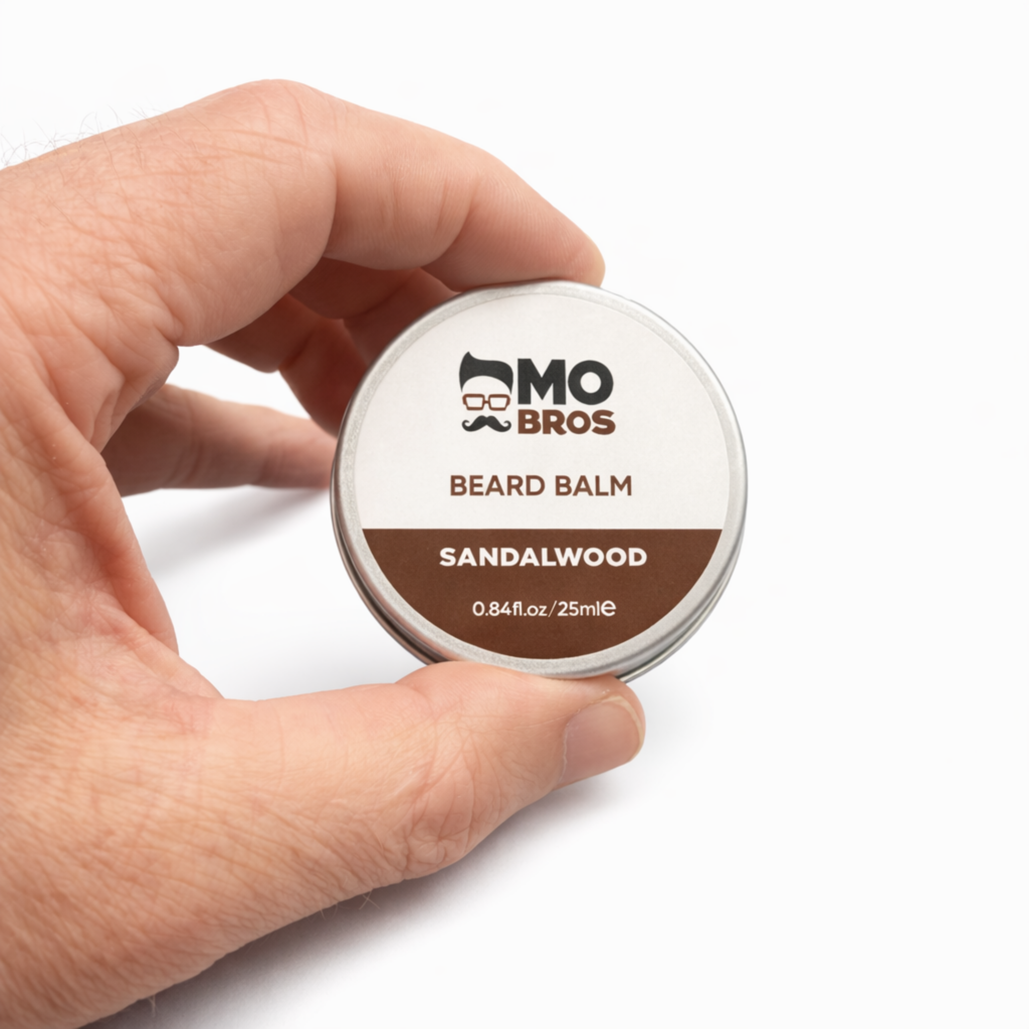 Mo Bros Sandalwood Beard Balm 25ml held in hand for size reference