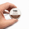 Mo Bros Sandalwood Beard Balm 25ml held in hand for size reference
