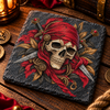 Dark grey slate coaster featuring a pirate skull wearing a red bandana with crossed swords, ornate gold details and black foliage.