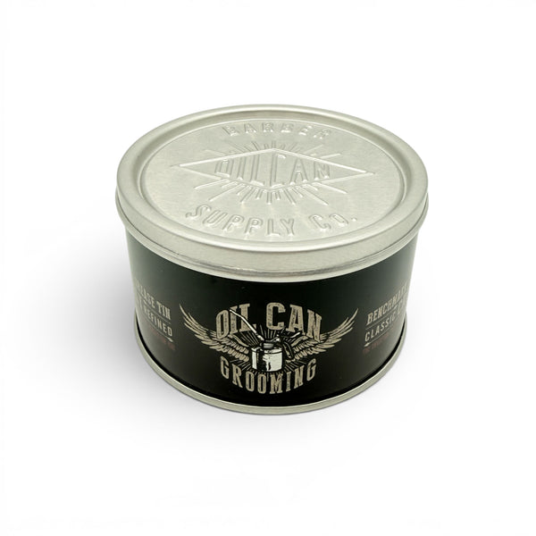 Oil Can Grooming's Benchmark Classic Hair Cream tin with vintage style grooming design on white background