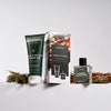 ManCave Amber & Vetiver Shower Gel and Eau de Toilette Gift Set displayed with matching grooming products.