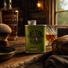Angel’s Share shave oil with whisky glass and shaving brush in rustic cabin setting