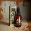 Beard oil bottle with packaging on rustic background