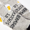 close up of it’s 5 o’clock somewhere slogan on socks