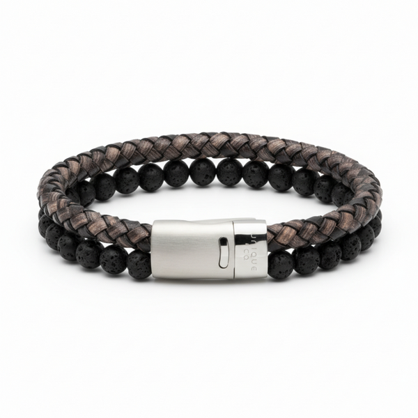 Black braided leather and lava stone bead bracelet with stainless steel magnetic clasp on a white background