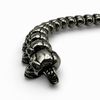 Side detail of black IP plated stainless steel skull link bracelet