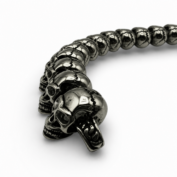 Side detail of black IP plated stainless steel skull link bracelet