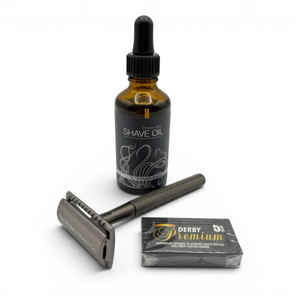 The Brighton Beard Co. Traditional Shave Kit with safety razor, shave oil and Derby razor blades on a white background
