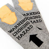 close up of Warning Choking Hazard socks showing text and arrow detail