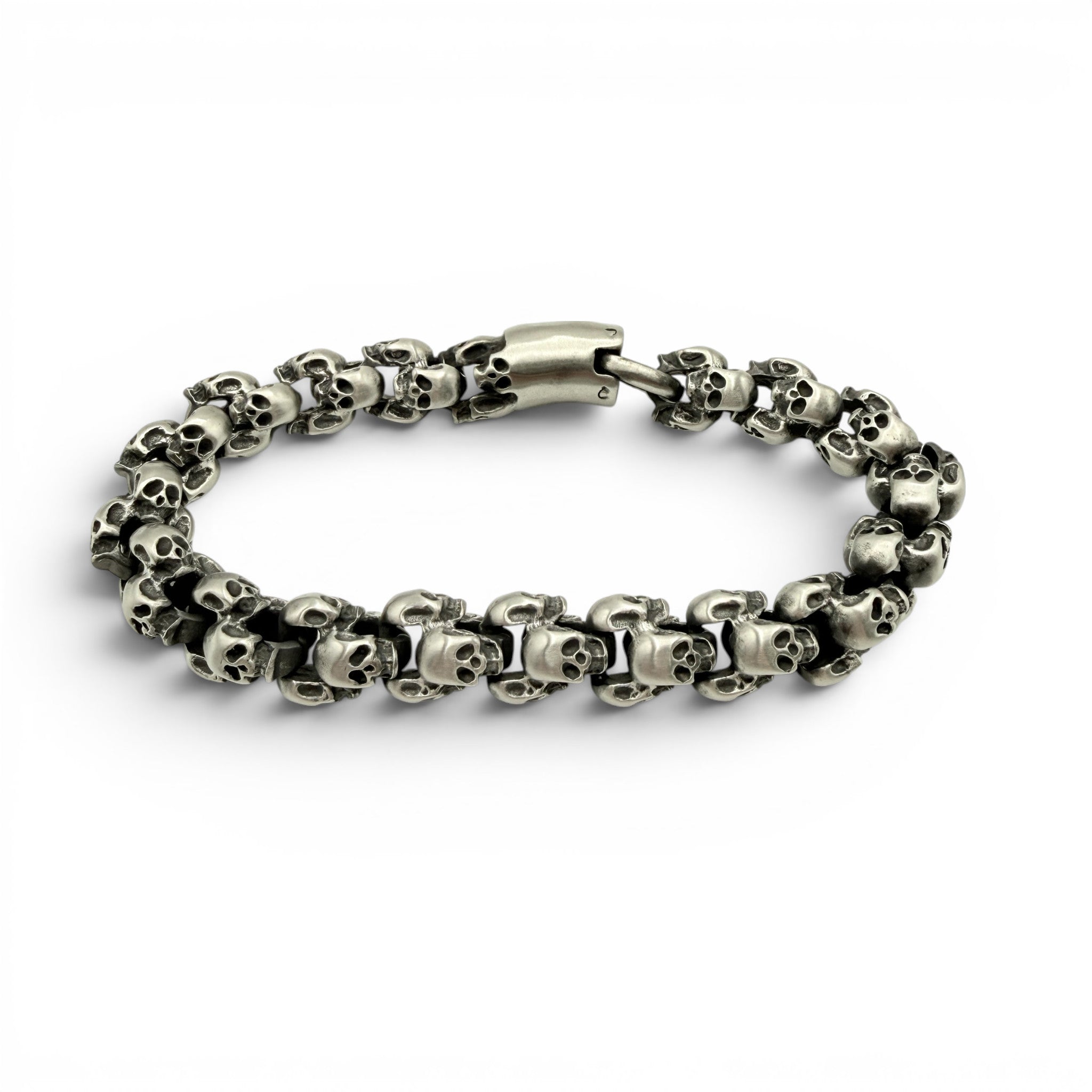 Chunky brushed stainless steel skull bracelet with matte finish and detailed skull links