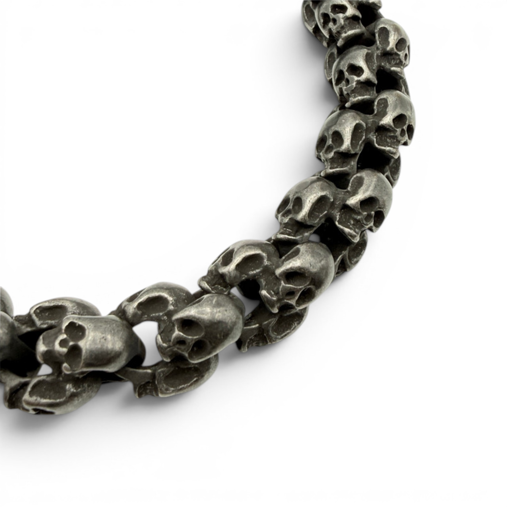 Close up of oxidised skull bracelet showing textured skull link detail