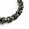 Close up of oxidised skull bracelet showing textured skull link detail