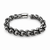 Chunky polished stainless steel skull bracelet with detailed skull links and secure clasp