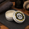 Dear Barber Shaping Cream 20ml open styling cream tin in classic barber shop lifestyle scene with grooming accessories