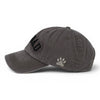 Grey washed vintage Dog Dad baseball cap shown from the side with curved peak and embroidered detail.