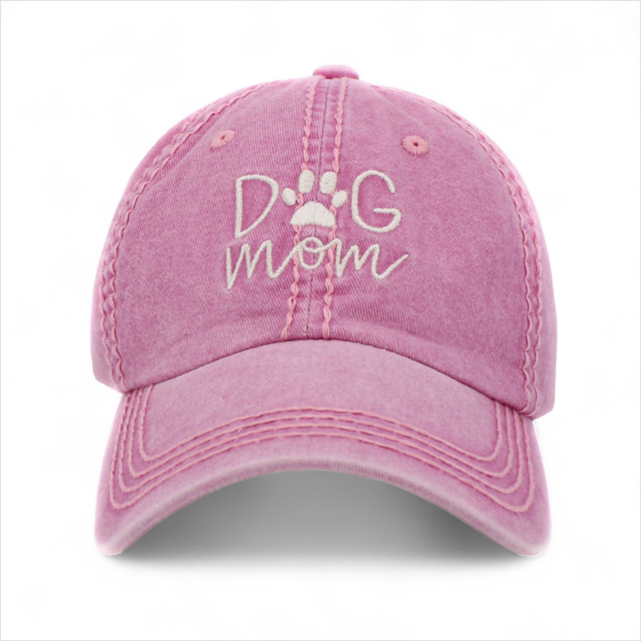 Pink washed vintage Dog Mom baseball cap with embroidered front lettering and curved peak.