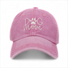 Pink washed vintage Dog Mom baseball cap with embroidered front lettering and curved peak.