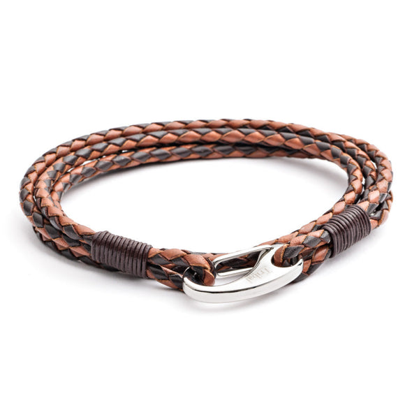 Double wrap braided leather bracelet in black and brown with stainless steel clasp on a clean white background