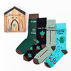 four pairs of gardening themed socks laid out with different designs