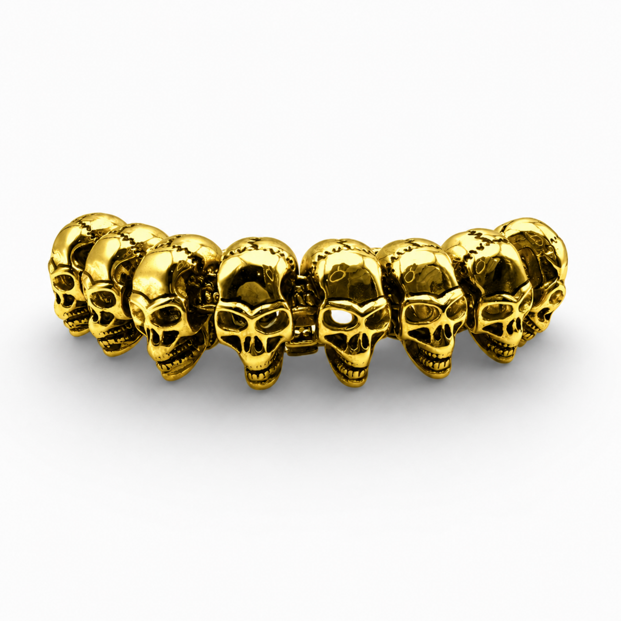Close up detail of gold skull links on a heavyweight bracelet
