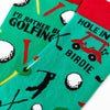 close up of golf themed socks showing clubs balls and course design