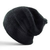 Rear view of black heather knit slouch beanie showing oversized shape and stretch fit.