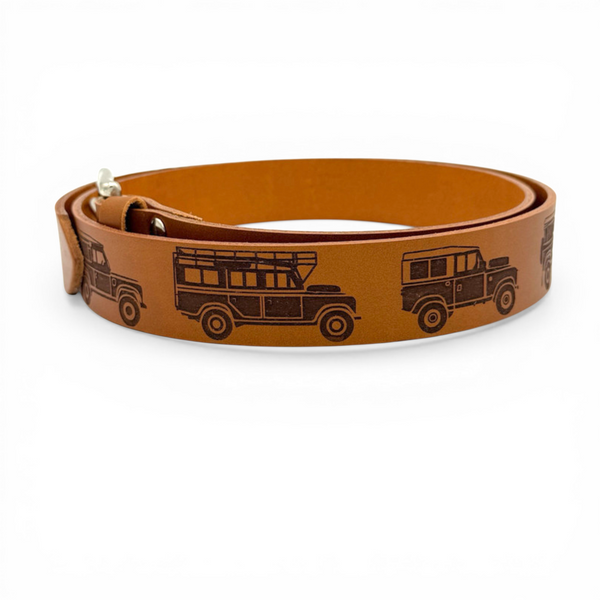 Brown leather belt with engraved Land Rover design and metal buckle on white background