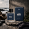 Mancave Sea Salt Eau De Toilette in a moody coastal spa inspired lifestyle scene with dark stone textures and driftwood accents