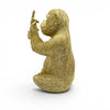 Medium golden resin monkey with middle finger on white background
