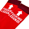 Close up of bold legend slogan and arrow design on red novelty socks