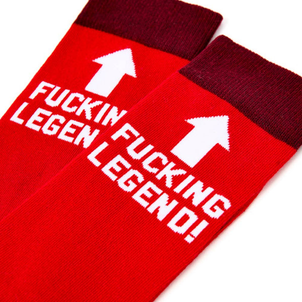Close up of bold legend slogan and arrow design on red novelty socks