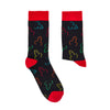 Pair of black novelty socks with red heel and toe featuring colourful all-over pattern