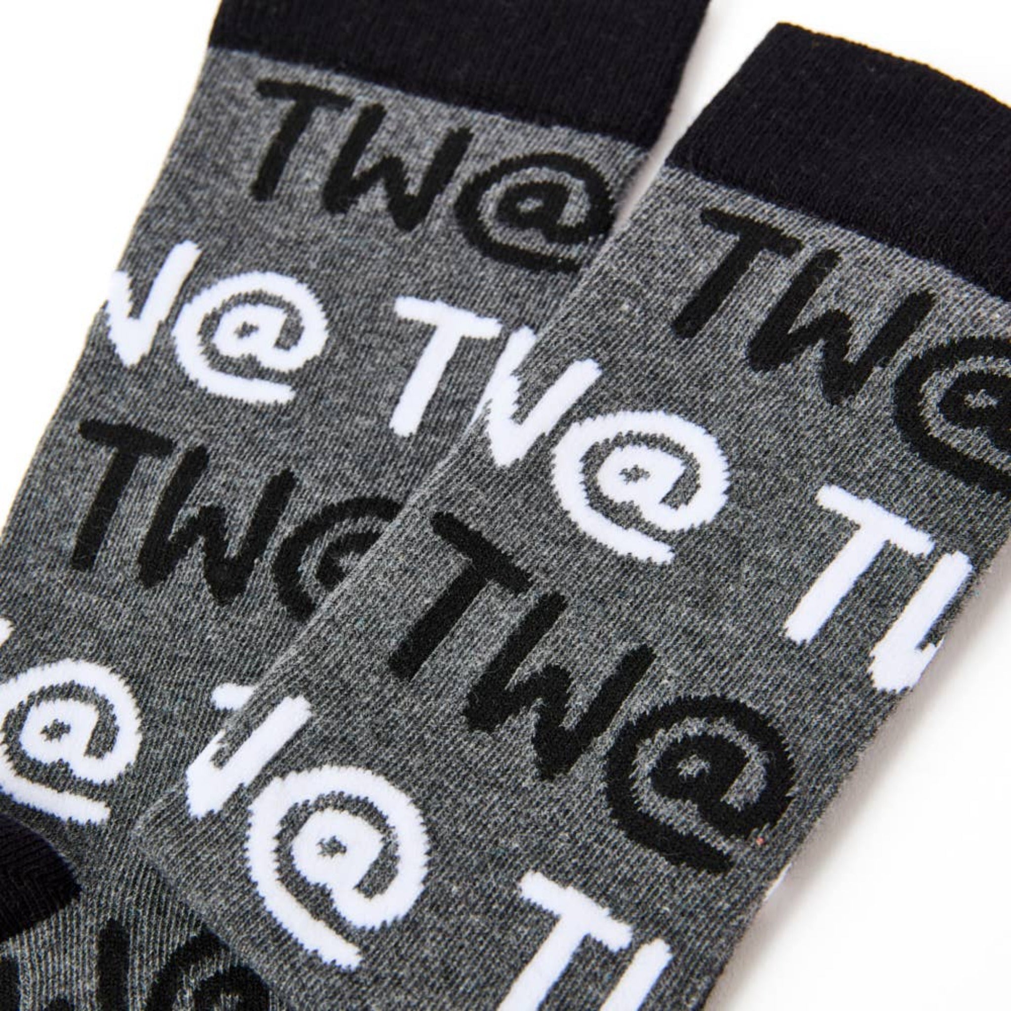Close up of Tw@ text pattern on men’s novelty socks