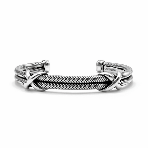 Men’s sterling silver cuff bracelet with double rope design and crossover detail on white background