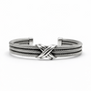 Men’s sterling silver cuff bracelet with triple rope crossover detail on white background