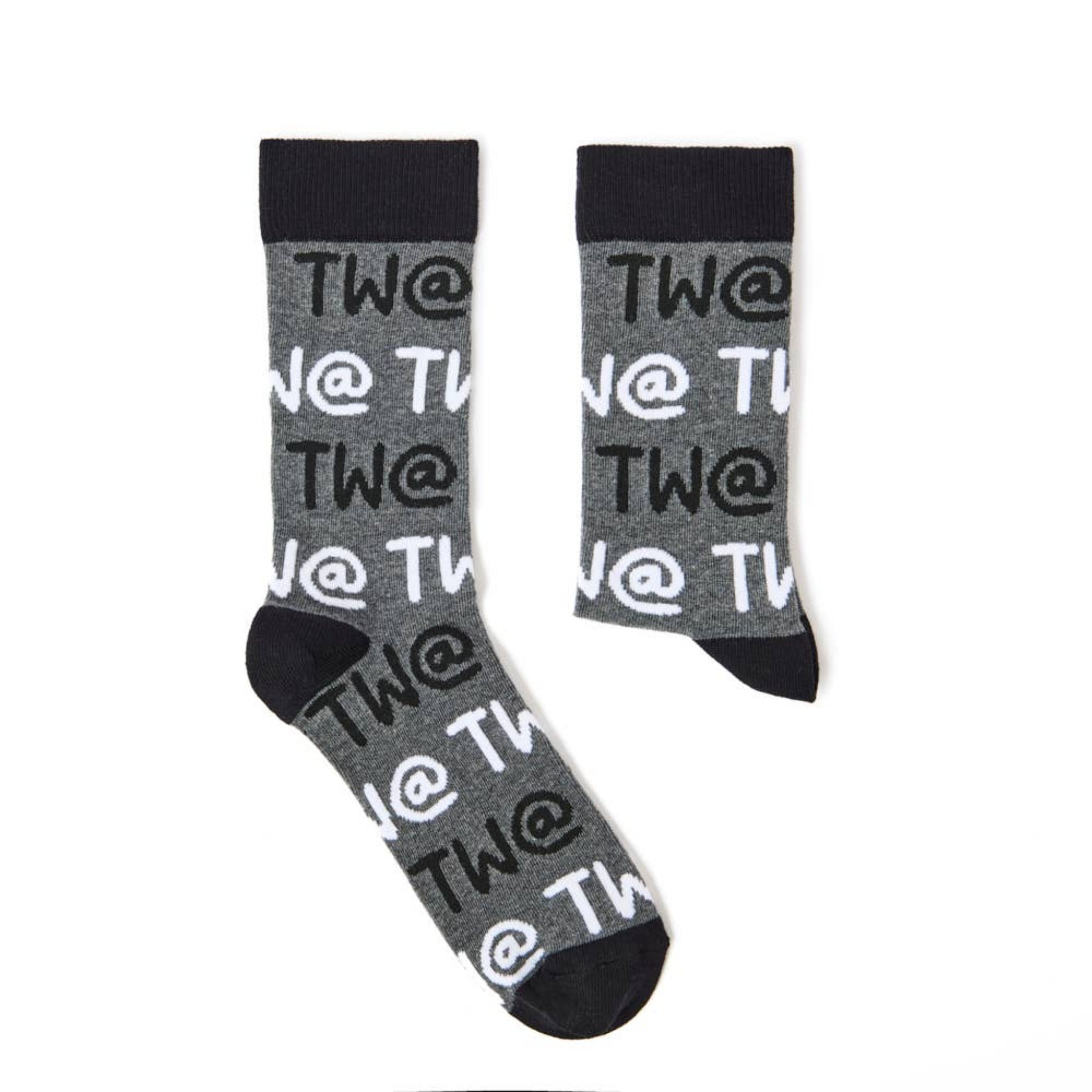 Detailed view of Tw@ lettering on novelty sock