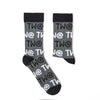 Detailed view of Tw@ lettering on novelty sock