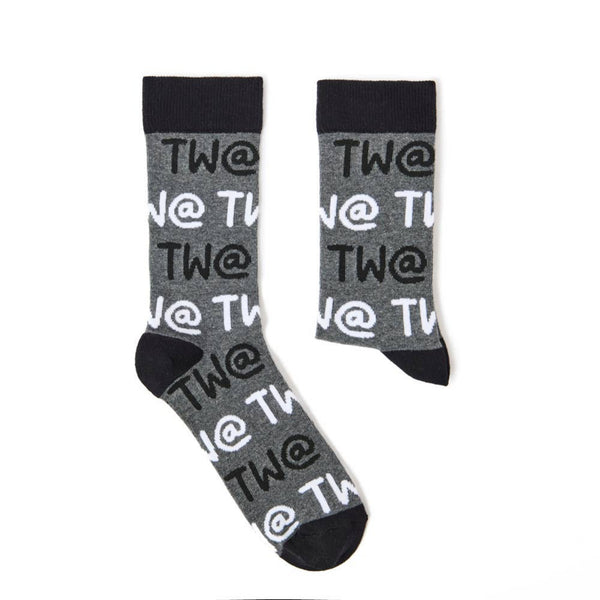 Detailed view of Tw@ lettering on novelty sock