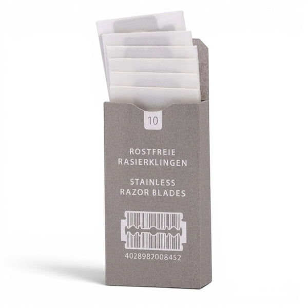 Opened pack of MÜHLE stainless steel double edge razor blades in paper packaging