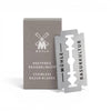 Pack of 10 MÜHLE stainless steel double edge razor blades beside branded packaging on white background