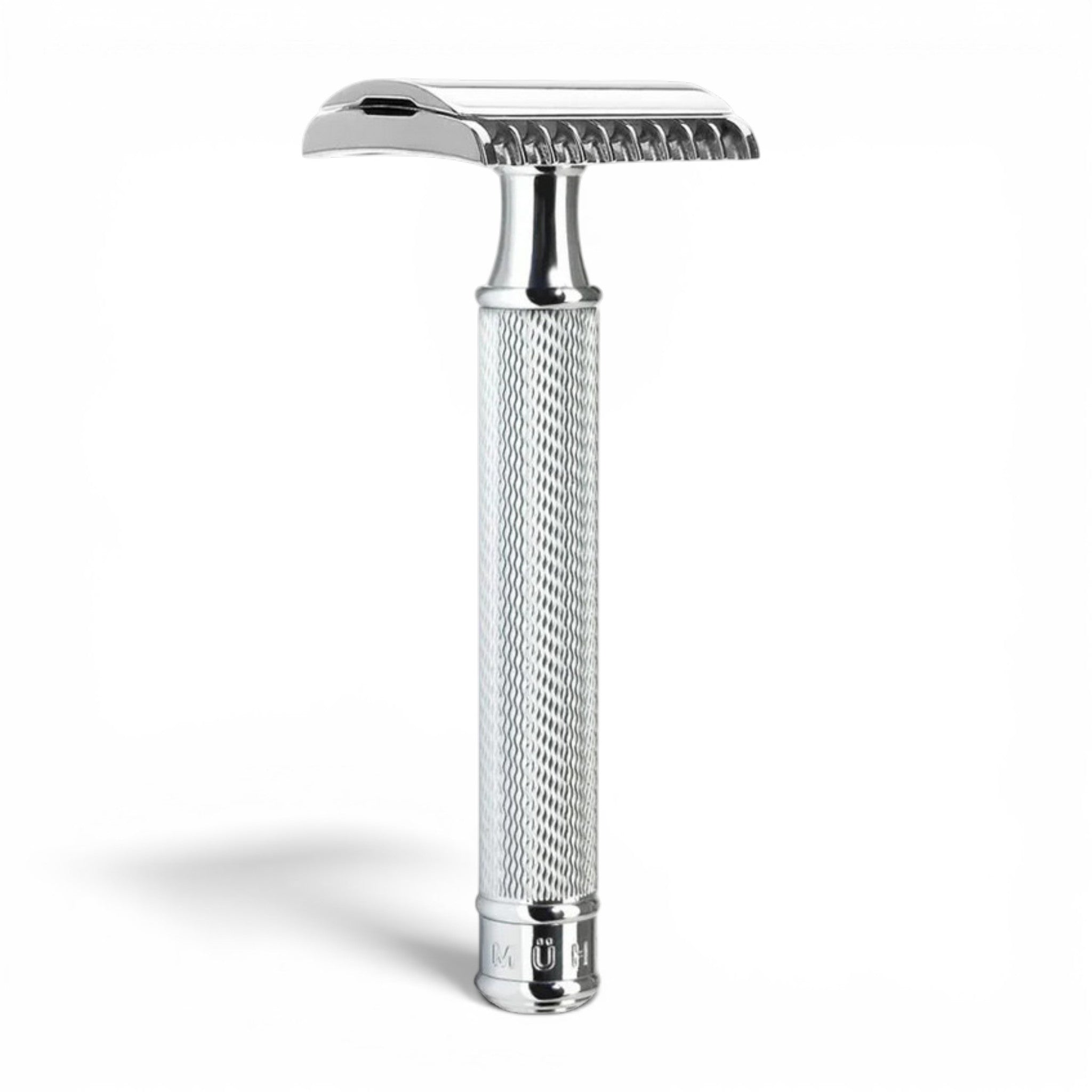 Angled view of MÜHLE R41 chrome open comb safety razor with textured handle