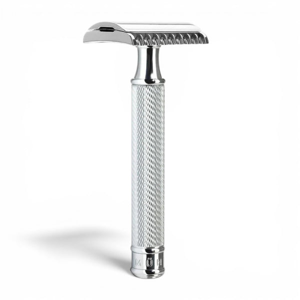 Angled view of MÜHLE R41 chrome open comb safety razor with textured handle