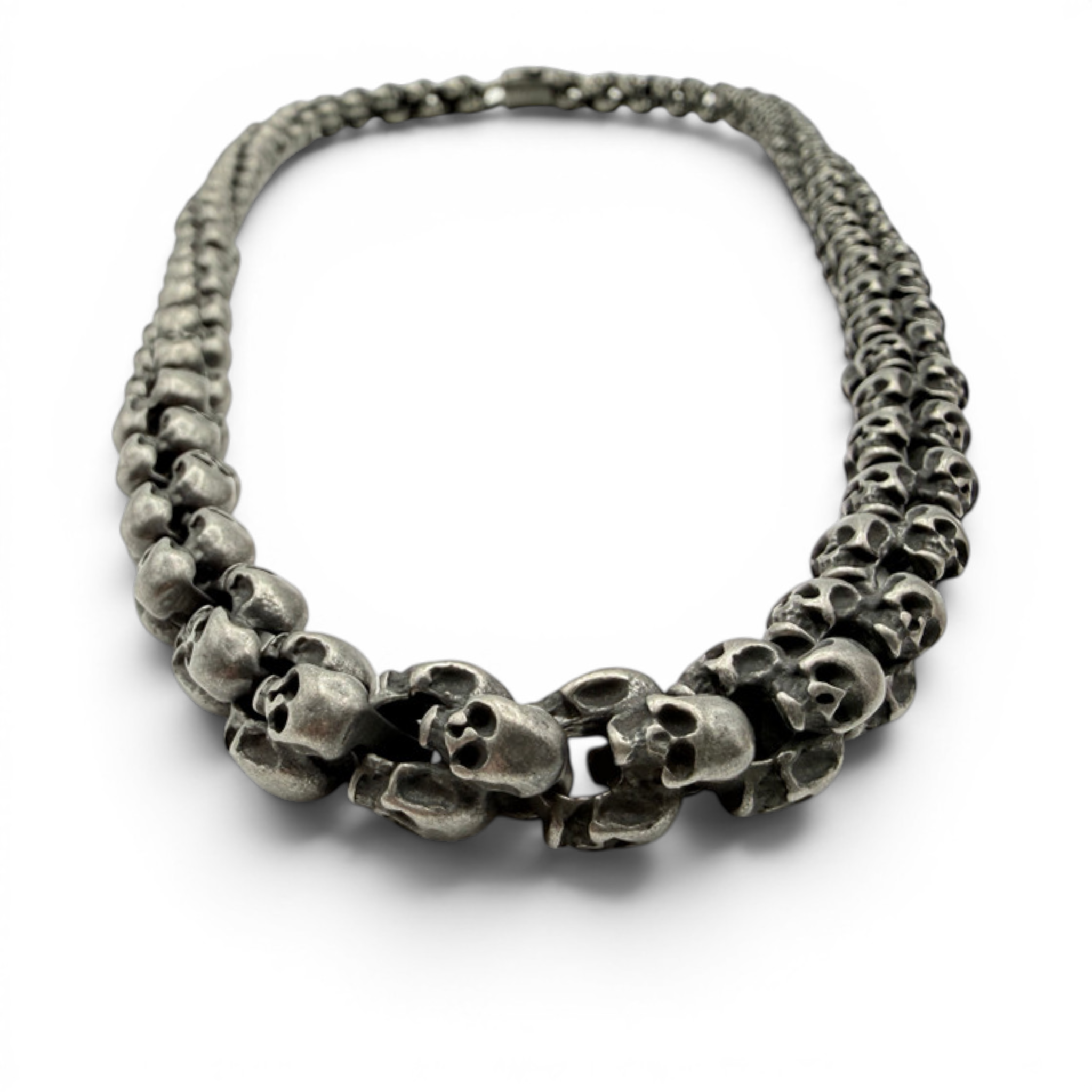 Oxidised skull necklace arranged in natural shape showing thickness and finish