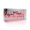 Angled side view of the pink Cocktails glass neon sign inside a transparent acrylic display box