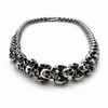 Front view of polished skull link necklace showing interlocking skull design