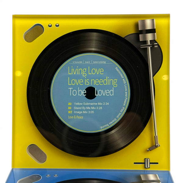Record player design glass coaster on a white background with yellow turntable style detail and vinyl record print